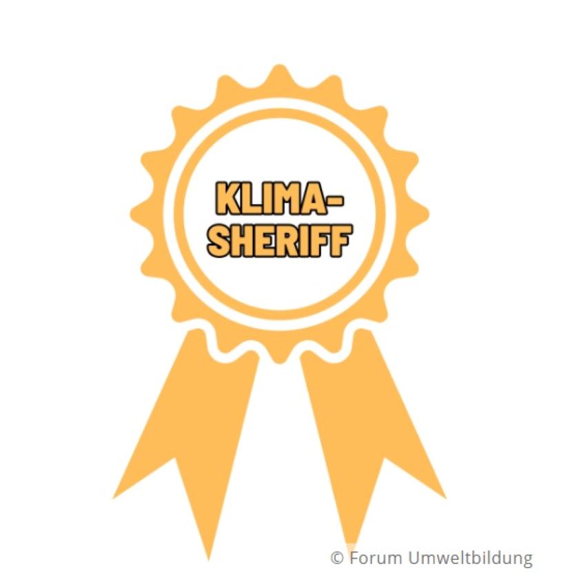 Ein gelbes Abzeichen mit der Aufschrift Klima-Sheriff