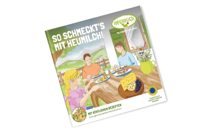Laura und ihre Eltern am Tisch mit köstlichen Käsegerichten